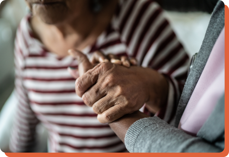 hands of a doctor supporting a senior patient at home